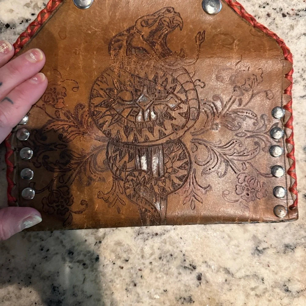 Brown hand tooled leather wallet